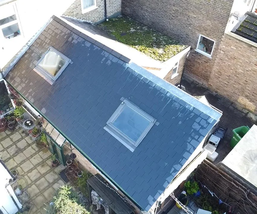 Two new Velux roof windows fitted into a new slate roof on a rear extension