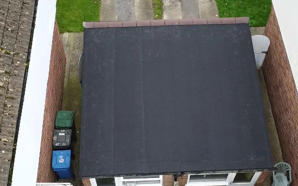 New black flat roof on a single-storey rear extension, seen from directly above