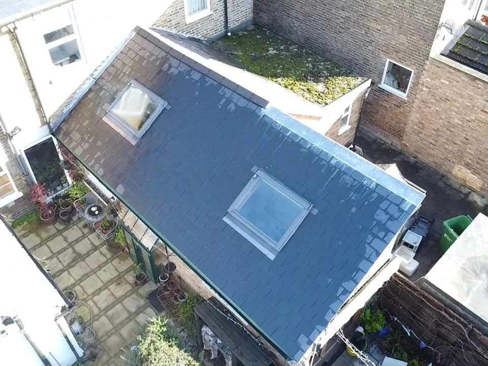 Two new Velux roof windows fitted into a new slate roof on a rear extension